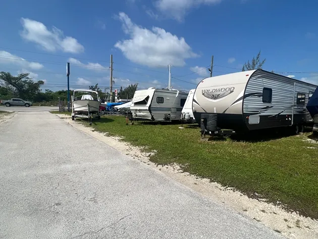 Outdoor vehicle storage with RVs and boats at Big Pine Storage.