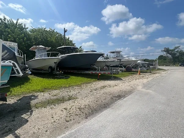 Outdoor vehicle storage with boats at Big Pine Storage.
