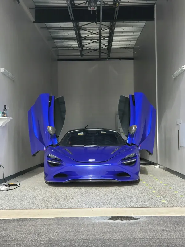 Blue sportscar in interior storage unit.