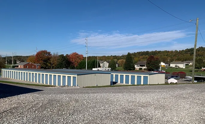 Wide-angle view of storage units and fencing at Volunteer Storage Seymour.