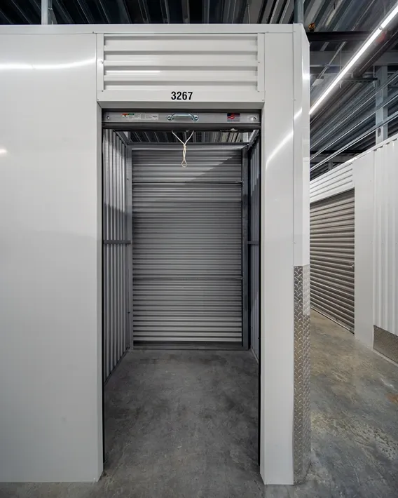 Long, straight hallway lined with storage units at Storage Lounge.